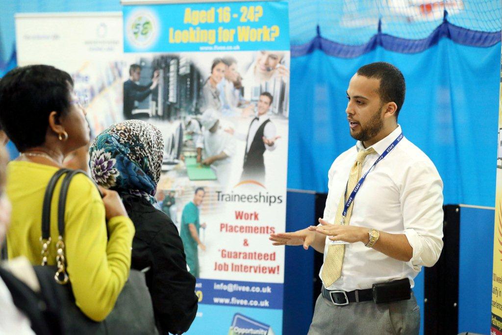 5E staff member Ibsa, guides job fair visitors on our available programmes and courses